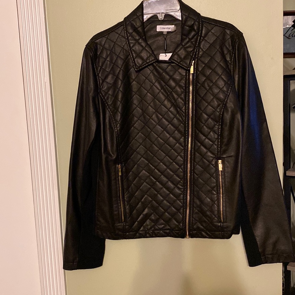 Black leather look jacket with side spandex. Zip front and zip pockets.
